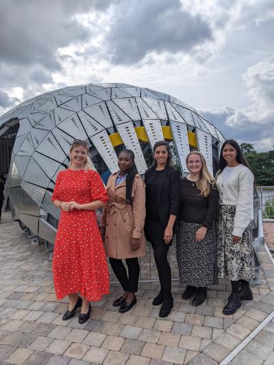 The Salix scotland team standing next to Hydro Ness a hydro electric turbine on the River Ness in Inverness